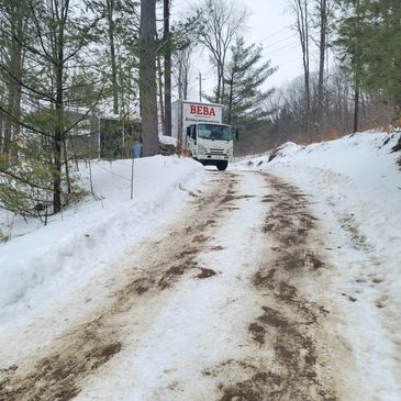 20 feet moving truck up an icy and snow covered hill 