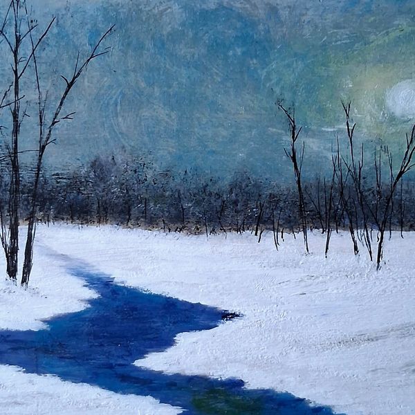 Snowy landscape with bare trees and a winding blue river.