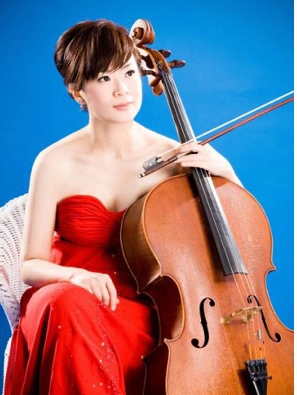 Ms. Jocelyn Wei (Wei, Yi-Ying) in a red dress, holding a violin in her hand