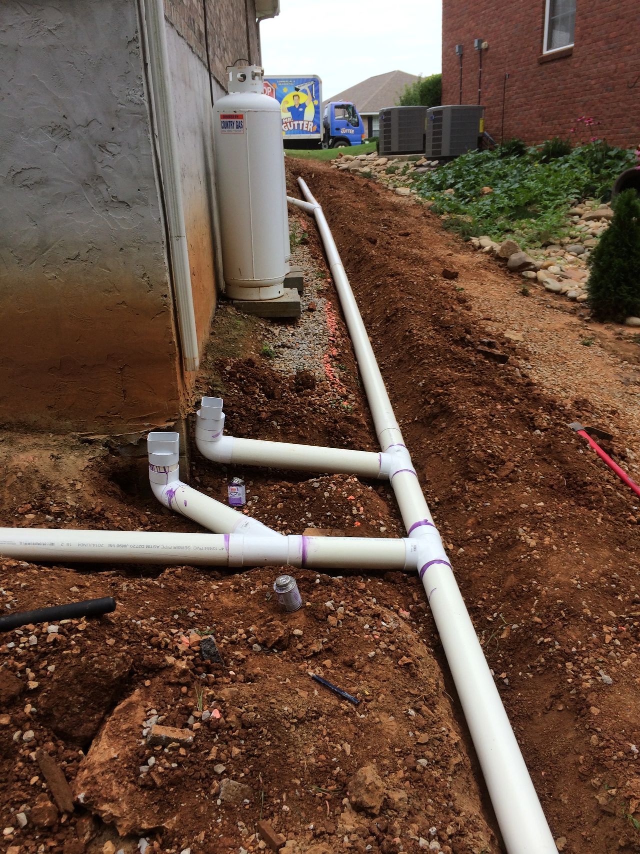 MR GUTTER installing Drains MR GUTTER installing Drains