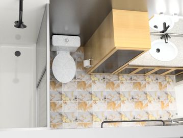 Top-down view of a compact bathroom with a patterned tile floor.
