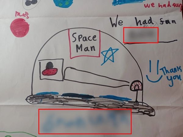 Child's drawing of a space dome labeled 'Space Man' with planets and a thank you message.