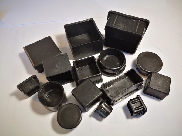 Samples of plastic plugs inserts ferrules endcaps made by Plastic Applications & Ventures, injection