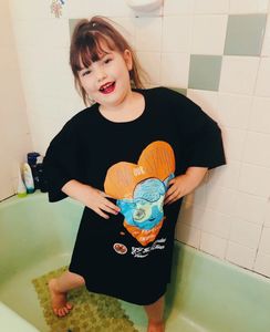 Young model strikes a charming pose in new IVA tee-shirt