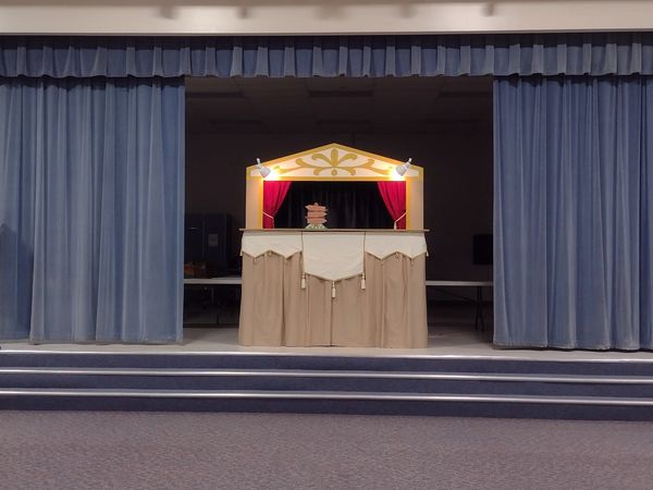 Booth puppet stage on a school auditorium stage