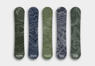 Snowboard designs with topographical maps of some US mountain ranges. 