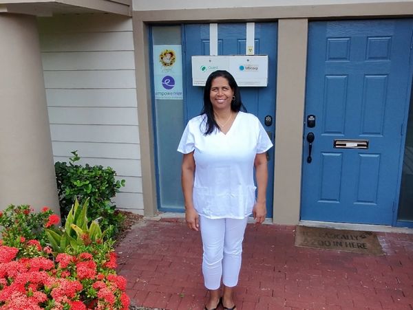 Meet Stephanie Adams statnsing at the entrance of Life Touch Massage and Lymphatic Care
