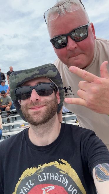 VB members meeting for the first time at an air show celebrating brotherhood and community.