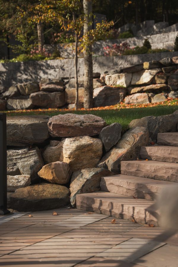 Stone stairs and rock wall in a garden.
