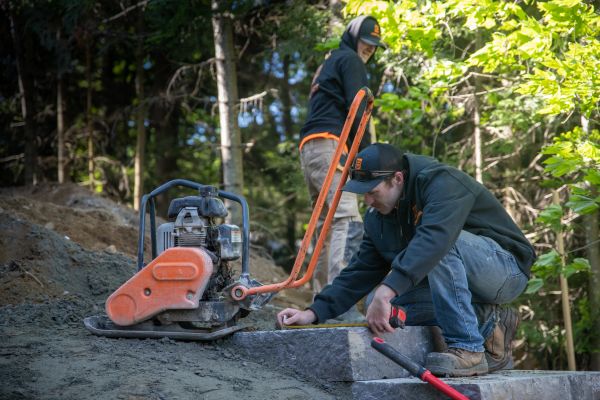 Two men working outdoors on a construction project.