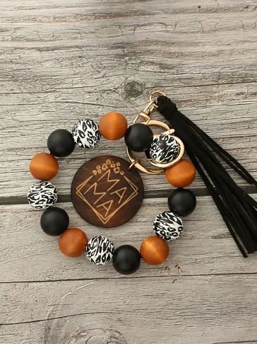 a bracelet with orange and yellow bids 