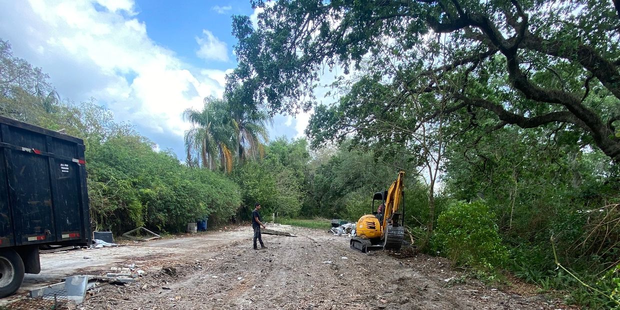 H&M Tree Service professional land clearing in Tampa, FL, preparing property for new development.