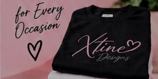 Stack of custom shirts with Xtine Designs logo on pink background.