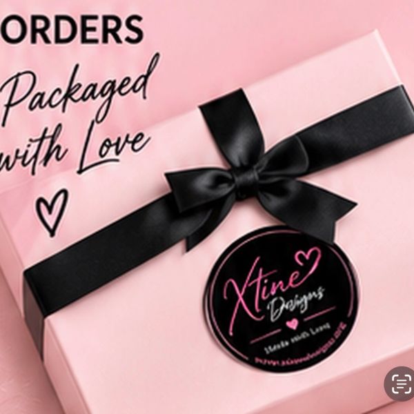 Gift box with a black ribbon and heartfelt message.