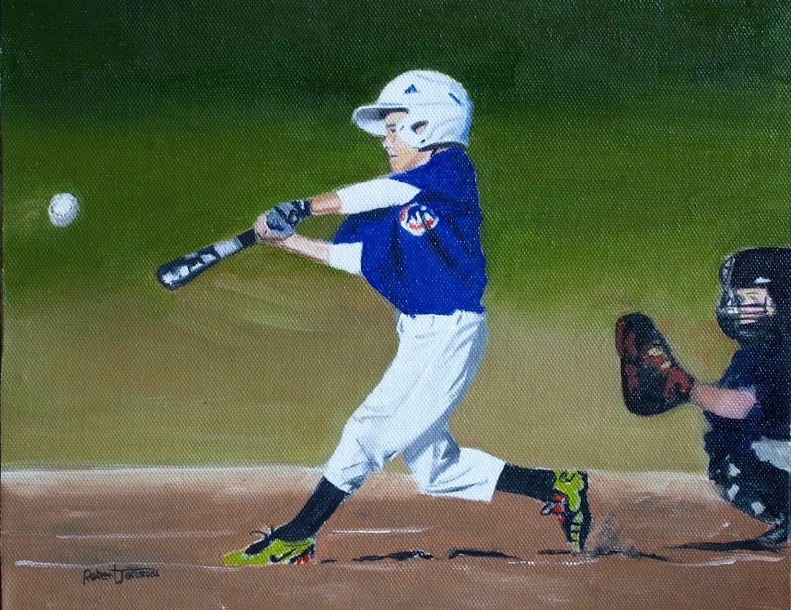 Young baseball player hitting the ball.