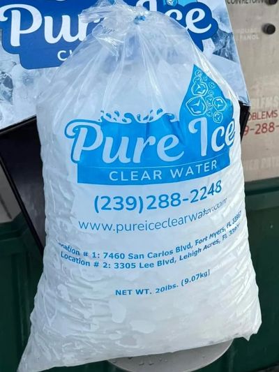 A 20 lb Pure Ice Clear Water ice bag priced at $3, partially dispensed from a vending machine.