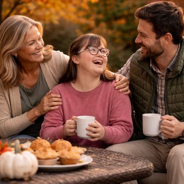 Happy family enjoying autumn outdoors with coffee and pastries.