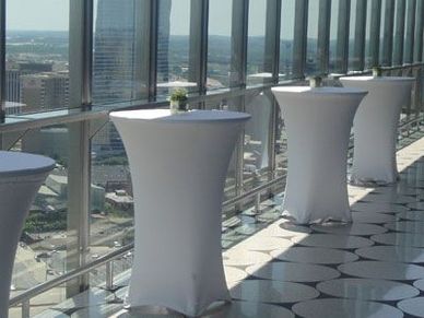 white spandex covers with cocktail tables 