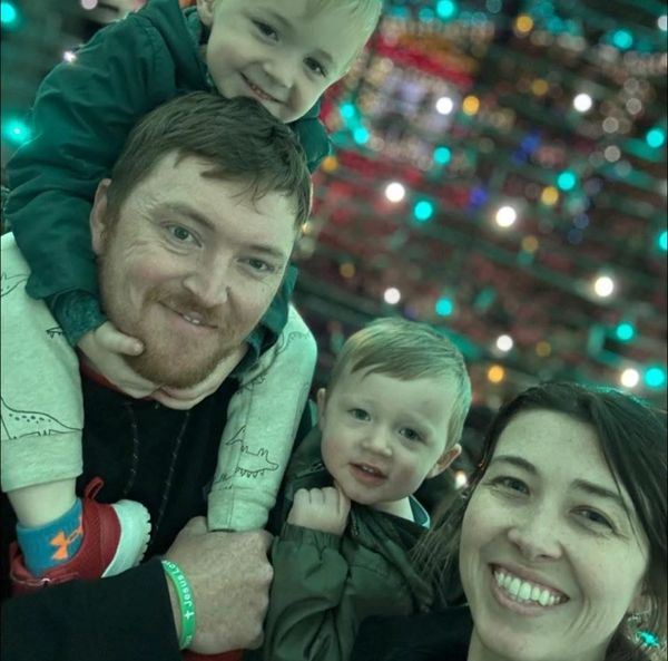 Happy family with two boys smiling together.