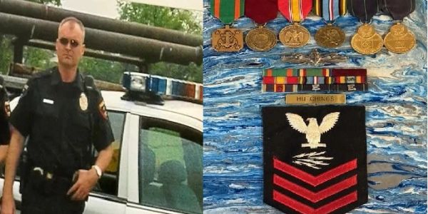 Police officer standing next to a car and military medals with insignia.
