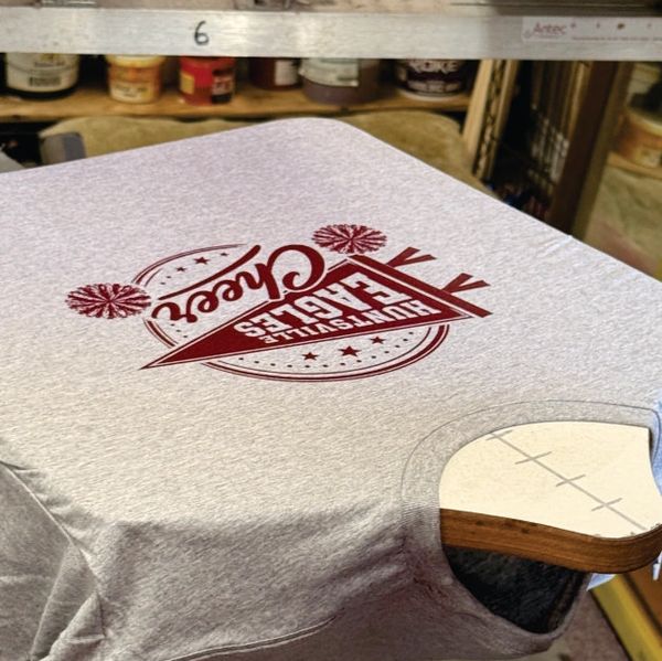 Tshirt on screen printing press