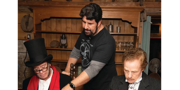 Director, Joe Valenti offering direction to Jerry Parisi (Ebenezer Scrooge) and Michael Bertolini (J