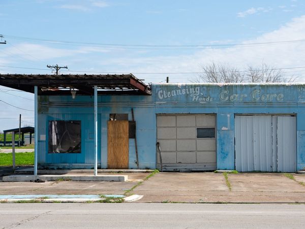 Vacant former commercial building at a redevelopment site undergoing environmental assessment.