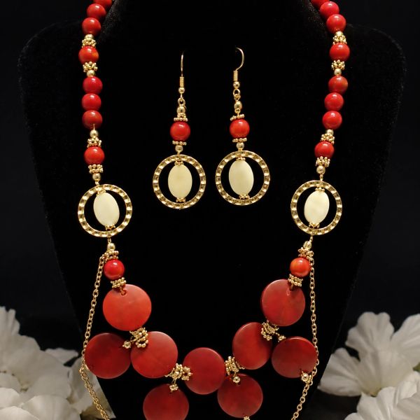 Elegant red and gold necklace with matching earrings.