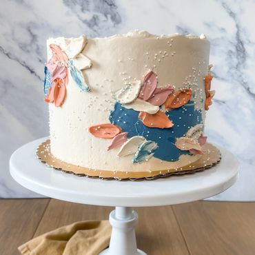 Abstract, modern palette knife cake with Swiss meringue buttercream. 
