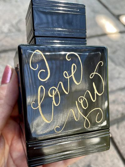 San Diego calligrapher engraver Lisa McCague men's cologne bottle engraving