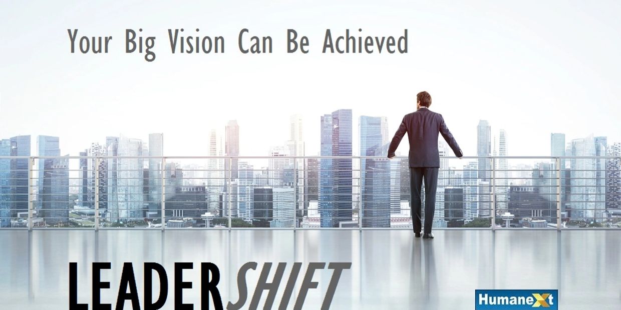 Businessman overlooking city skyline with motivational text about achieving big vision.