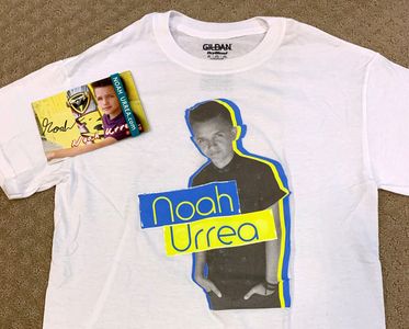 White T-shirt featuring a graphic of Noah Urrea with a signed card.