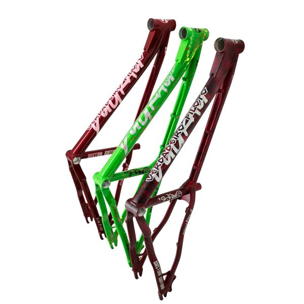 Three colorful bicycle frames with graffiti-style designs.