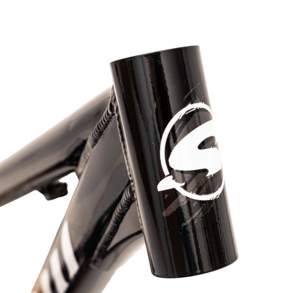Close-up of a shiny black bicycle frame with a white logo on the head tube.