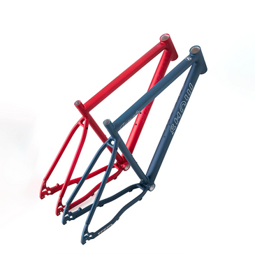 Two bicycle frames in red and blue colors isolated on white.