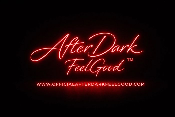 Neon red sign reading 'AfterDark FeelGood' with a website link below.