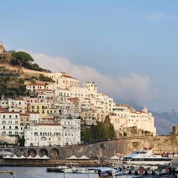 Amalfi is a town in a dramatic natural setting below steep cliffs on Italy’s southwest coast.