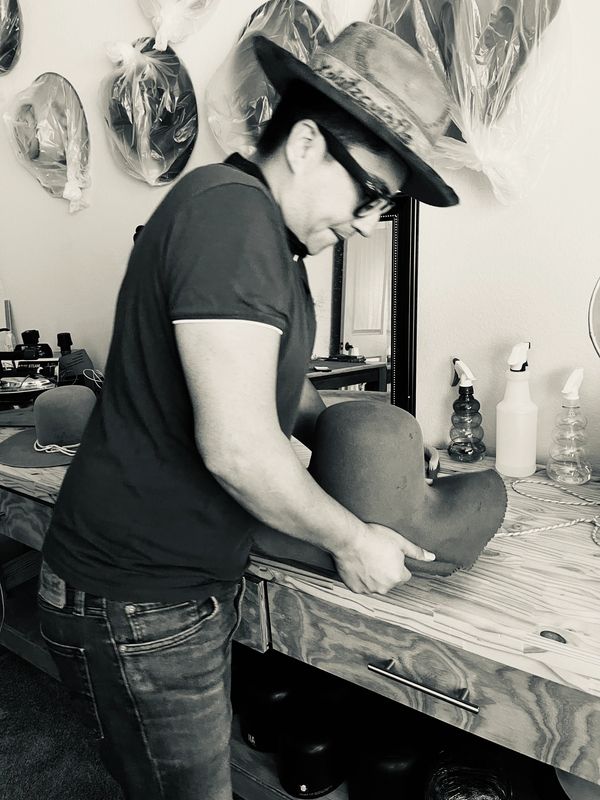 Hatter working in workshop