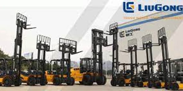 Line of yellow LiuGong forklifts with raised forks in an outdoor lot.