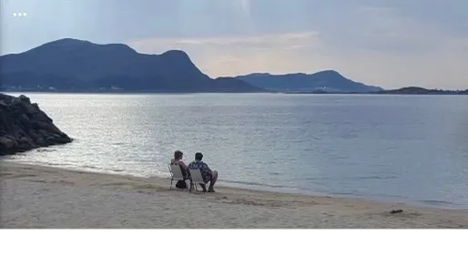 Herleif and Laila Ulstein on the beach by the fjord