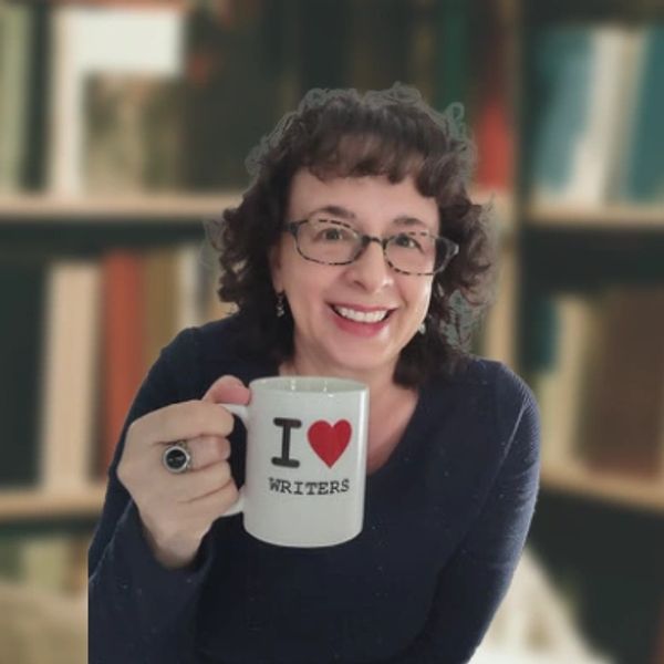 Michelle holding I Love Writers mug