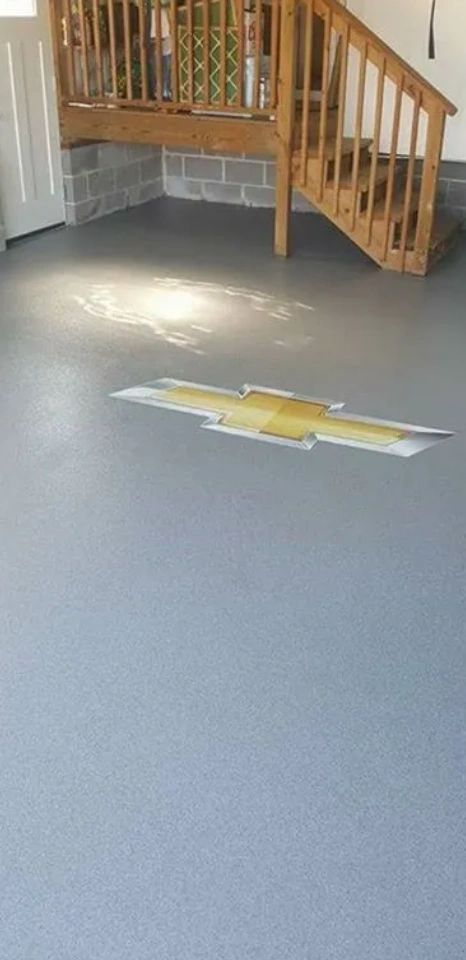 Epoxy decorative flake broadcast garage with custom embellishments 