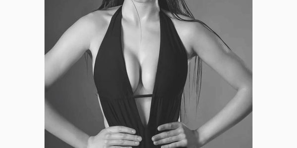 Woman representing breast augmentation with implants