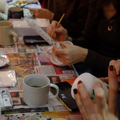 a group of people taking part in a candle making workshop ran by lemonade events in london