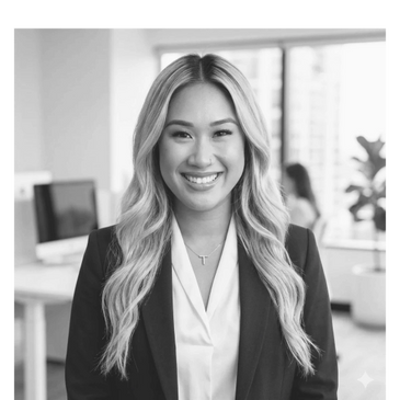 Professional woman smiling confidently in an office setting.