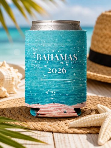 A cold drink in a 'Bahamas 2026' can cooler at the beach.