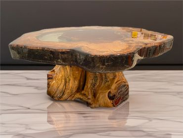 Rustic wooden coffee table with a natural, glossy finish and sturdy base.