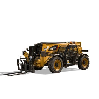 Yellow CAT telehandler with forklift attachment.