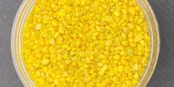 SchabelTech Safety Yellow Roofing Granule on black backdrop