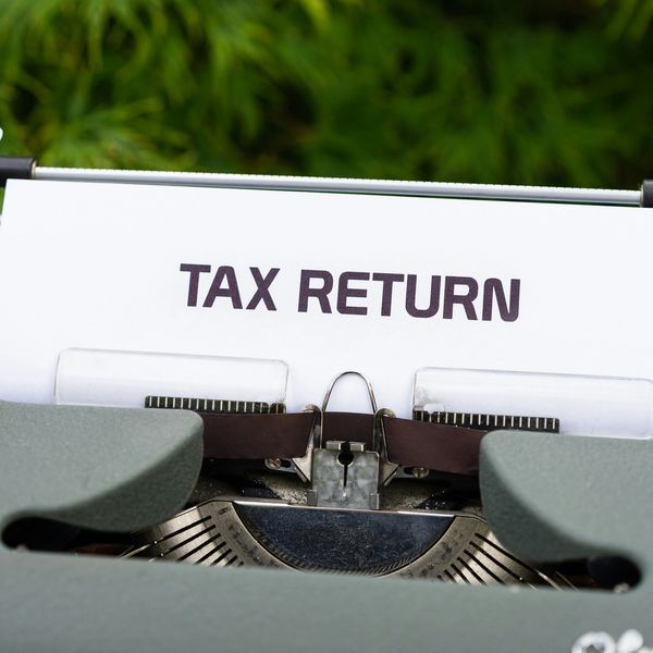 Paper with 'TAX RETURN' typed on a vintage typewriter.
